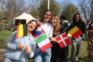 Jubilee and inauguration students with flags at international people's college a folk high school in Denmark